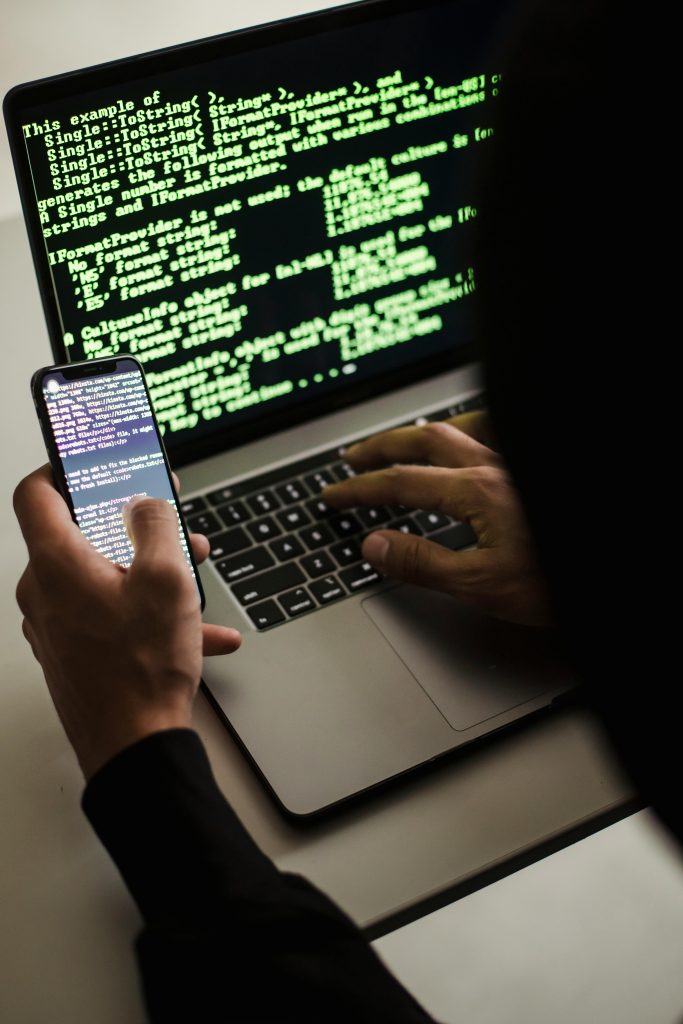 someone on their computer with a cyber security attack